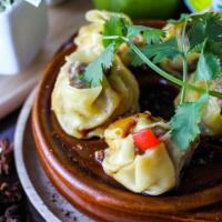 Jeeb (Tea Rose) · Steamed Thai dumplings stuffed with minced pork, shrimp and water chestnuts, served with chi...