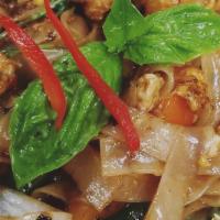Pad Kee Mao (Drunken Noodle) · Spicy-mild. Sauteed wide rice noodles with chicken, egg, onions, bell peppers, green beans a...