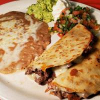 Quesadilla Mexicana · Served with beans and sour cream.