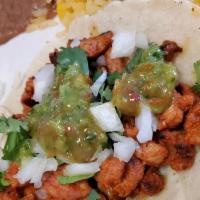 Tacos Al Pastor (3) · 3 pieces. Rice, beans, and pico de gallo.
