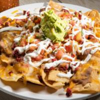 Nachos · Most popular. Vegetarian. Homemade nachos topped with refried beans, Monterey Jack cheese, p...