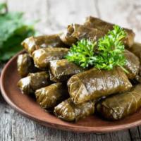 Grape Leaves · Four grape leaves stuffed with rice and lemon.