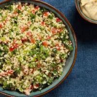 Tabbouleh · Chopped parsley with mint, tomatoes, and onion, and dressed with olive oil and lemon.