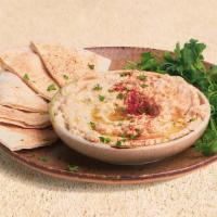 Baba Ghanouj · Eggplant spread served with fresh pita.