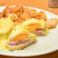 Eggs Benedict · Two poached eggs, Canadian bacon on English muffin with hollandaise sauce.