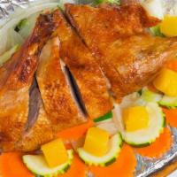 Spring Break Duck · Roasted duck, then fried to crispy, topped with a variety of vegetables, and house salad.