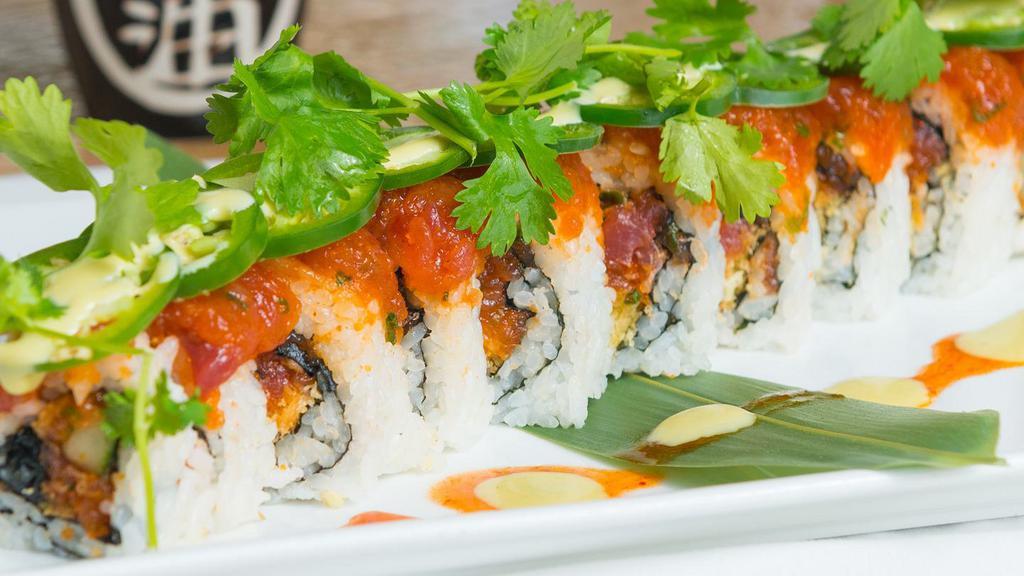Spicy Lover Roll · Spicy tuna, cucumber, tempura flakes roll, topped with spicy tuna, jalapeño, cilantro and spicy wasabi. This item contains raw fish. Consuming raw or undercooked meats, poultry, seafood, shellfish, or eggs may increase your risk of food borne illness.