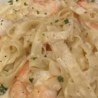 Shrimp Alfredo · Fettuccine pasta sautéed in an Alfredo sauce with jumbo shrimp.