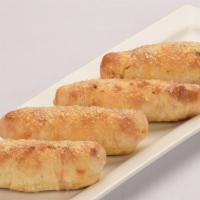 Pepperoni Rolls · Pepperoni and provolone cheese, hand rolled and baked.  Topped with Garlic Butter and Parmes...