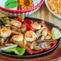 Fajita Texana · Grilled steak, chicken, shrimp, onions, bell peppers, served with rice, beans salad and corn...