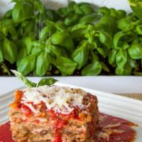 Eggplant Parmesan · Made Traditionally, Our Skinless Eggplant is Fried then Layered with Homemade Sauce and Mozz...