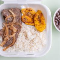 Pepper Steak · Steak sautéed with onions and green peppers with white rice, salad or sweet plantains with b...