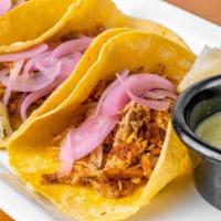 Taco(1) Cochinita Pibill · Traditional Yucatan, Mexico style cochinita pibil,. served in artisan tortilla and xnipec sa...