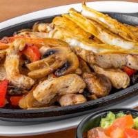 Fajitas De Pollo · Grilled chicken cooked with peppers, onion and mushrooms,. accompanied by 3 corn tortillas, ...
