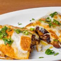Quesadilla Gringa · Delicious flour tortilla filled with our. exquisite meat al pastor and cheese