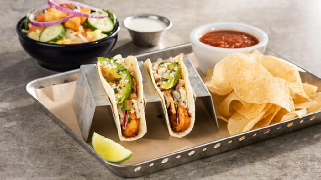 Lunch Combo - Spicy Shrimp Tacos · Two spicy chile-lime shrimp tacos in flour tortillas with pico, cilantro, avocado, coleslaw, queso fresco. Served with chips & salsa.