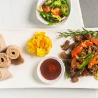 Lamb Tibs · Marinated Juicy and Tender cubed Lamb meat  sautéed with red onions, fresh tomatoes, garlic,...