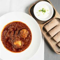 Doro Wot (Chicken) · Chicken Legs slowly cooked in a rich tomato sauce, seasoned with berbere(spicy chili powder)...