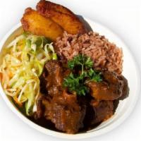 Negril'S Oxtail Stew · Slow-Braised Oxtails, Rice & Peas, Sautéed Cabbage, Sweet Plantains
