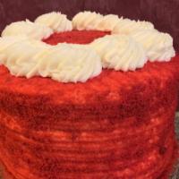 Red Velvet Cake Slice · Moist red velvet cake layers filled and decorated with our own cream cheese frosting.