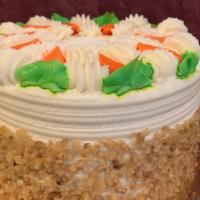 Carrot Cake Slice · Moist carrot cake layers filled and decorated with our own cream cheese frosting with walnut...