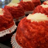 Red Velvet Cupcake · Red velvet cake topped with cream cheese icing rolled in red velvet crumbs.