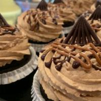 Mocha Caramel Cupcake · Devils food filled with caramel and topped with mocha mousse, chocolate and caramel drizzle.
