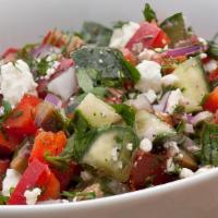 Greek Salad · Romaine lettuce, tomato, onions, cucumbers, kalamata olives, chickpeas and feta cheese.