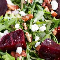 Beet Salad · Arugula, roasted red and golden beets, red onions, herd goat cheese, pistachios, balsamic vi...