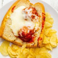 Meatball Parmigiana · Meatballs on a toasted roll with homemade tomato sauce, melted mozzarella and Parmesan.