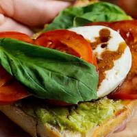 Caprese · Fresh mozzarella on a toasted roll with tomato, basil and olive oil.