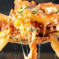 Baked Ziti · Penne pasta covered with a mixture of rich ricotta, tomato sauce, melted mozzarella and Parm...
