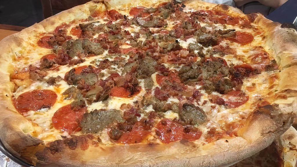 Meat Lovers · Pepperoni, sausage, meatball, ham, bacon, tomato sauce and mozzarella cheese