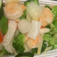 Seafood Delight · Combination of seafood then include shrimp, scallop, crabmeat, squid with vegetables in a sa...