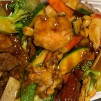 Happy Family · Jumbo shrimp, scallop, crabmeat, chicken, beef, roast pork sautéed with mixed vegetables in ...