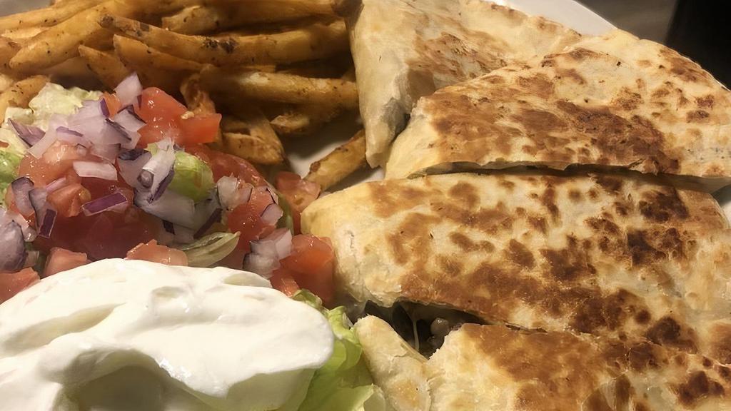 Quesadilla De Carne Asada · Steak Quesadilla served with your choice of french fries
or salad and sour cream