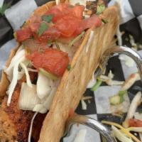 Mahi Taco Combo · Two Mahi fish tacos served with a side of rice and beans and our signature roasted corn.