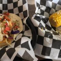 Chicken Taco · Grilled 100% white meat chicken in your choice of flour, corn or crispy tortilla with cheese...