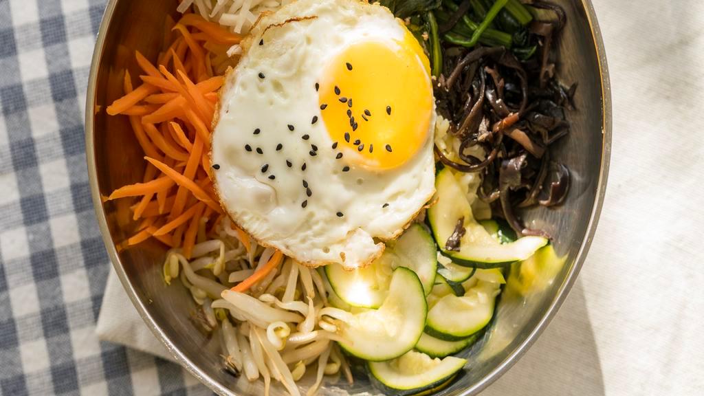Bibimbap · Spicy. Rice mixed with vegetables, meat, egg and chili pepper paste.
