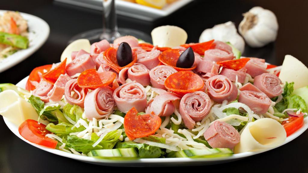 Antipasto Salad · Fresh Salad made with Lettuce, tomatoes, black olives, salami, provolone cheese, green peppers, pepperoncini & don't forget the anchovies. Served with customer's choice of dressing.