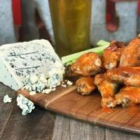 Oven Baked Wings 6Pc · Our wings are baked and crisped up in our oven and finished with your choice of sauce: Naked...
