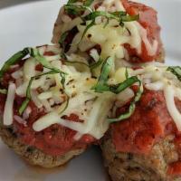 Cheesy Meatballs · Three handmade meatballs with melted cheese