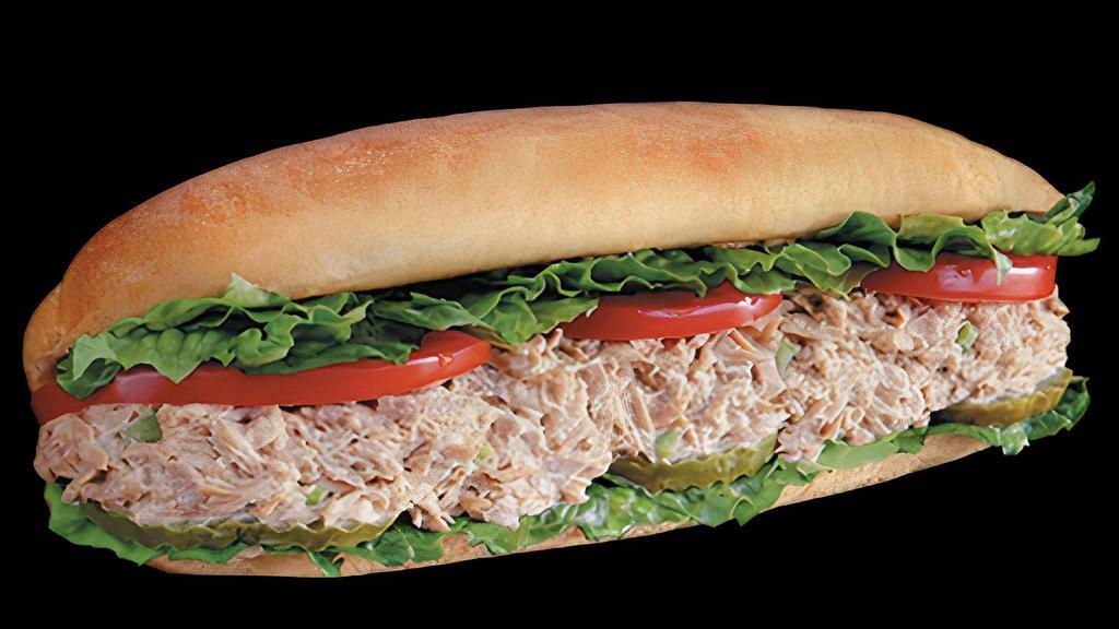 Tuna Sub · Combination of tuna, mayo, celery, and a touch of white pepper. Served with lettuce, tomatoes, and pickles on freshly baked bread.