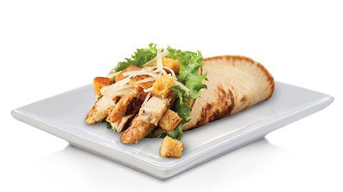 Chicken Caesar Pita · Grilled chicken breast. Served with Romaine lettuce, Caesar dressing, croutons, and parmesan cheese in a grilled pita.