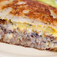Patty Melt · Double Cheeses on Thick Texas Bread buttered on grill.  Grilled Onions as well.