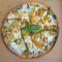 Chicken Pesto Pizza · Pesto sauce base with Mozzarella & Parmesan cheese, Roasted Chicken, Peppers & Carrots on a ...