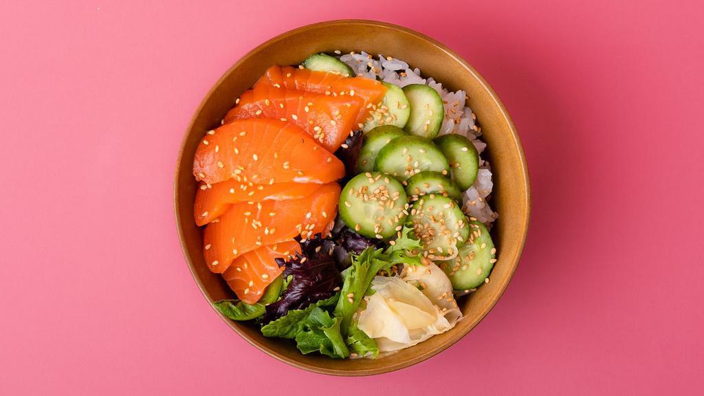 Salmon Sashimi Rice Bowl · Freshly sliced salmon sashimi over sushi rice with sliced cucumber, radish, ginger, crunchy greens, and sesame seeds.