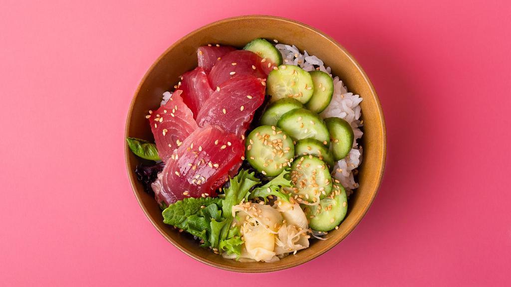 Tuna Sashimi Rice Bowl · Freshly sliced tuna sashimi over sushi rice with sliced cucumber, radish, ginger, crunchy greens, and sesame seeds.