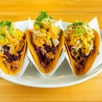 Mango Salsa Chicken Taco · Three tacos. Organic chicken, mango salsa, organic purple cabbage, guacamole, homemade chipo...