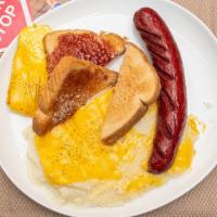 American Breakfast · Grits, toast, two eggs and choice of meat: sausage, bacon or ham.